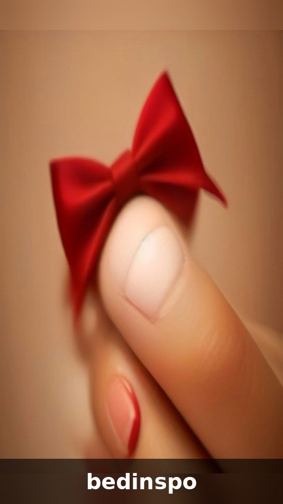 Hand-painted bow nail art on a cream Christmas base