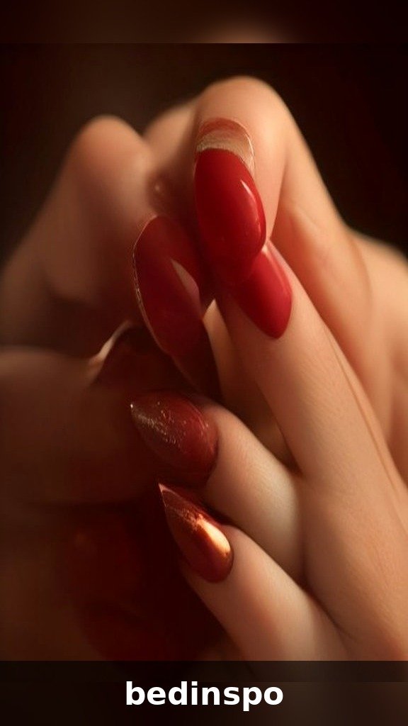 Ombre chrome fade nails blending burgundy into gold metallic
